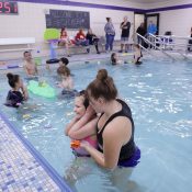 UWSP students, both volunteers and those in the fall 401 course, work closely with young students to help them learn aquatic skills.