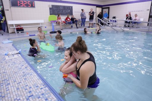 UWSP students, both volunteers and those in the fall 401 course, work closely with young students to help them learn aquatic skills.